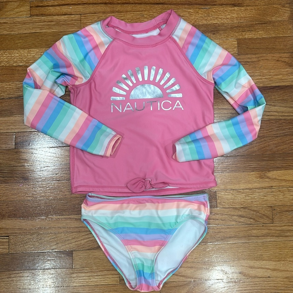 Used only once. Like new long sleeve bathing suit.